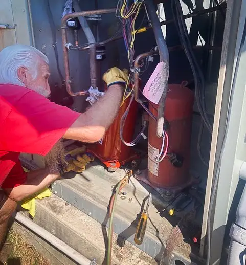 Checking a commercial hvac unit for problems.
