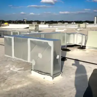 Rooftop installation of a commercial Trane system.